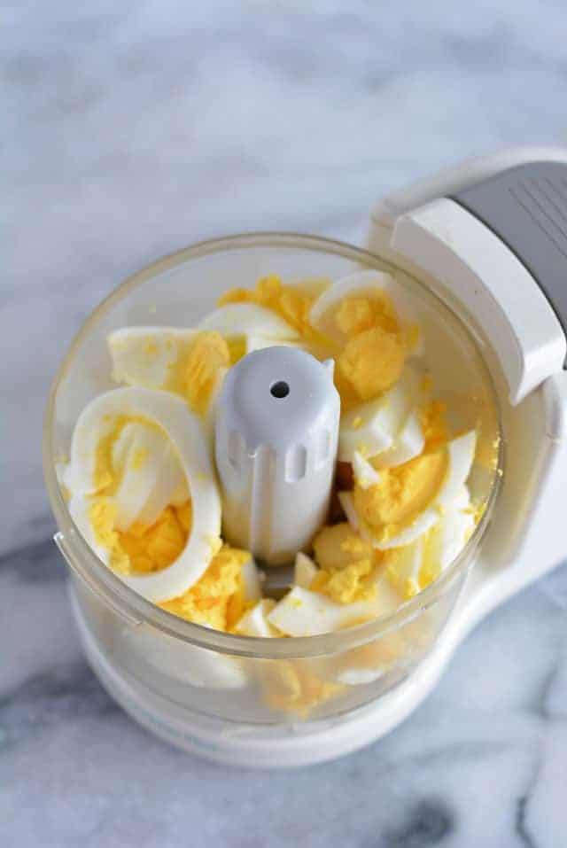 Chopped hard boiled eggs in a food processor.