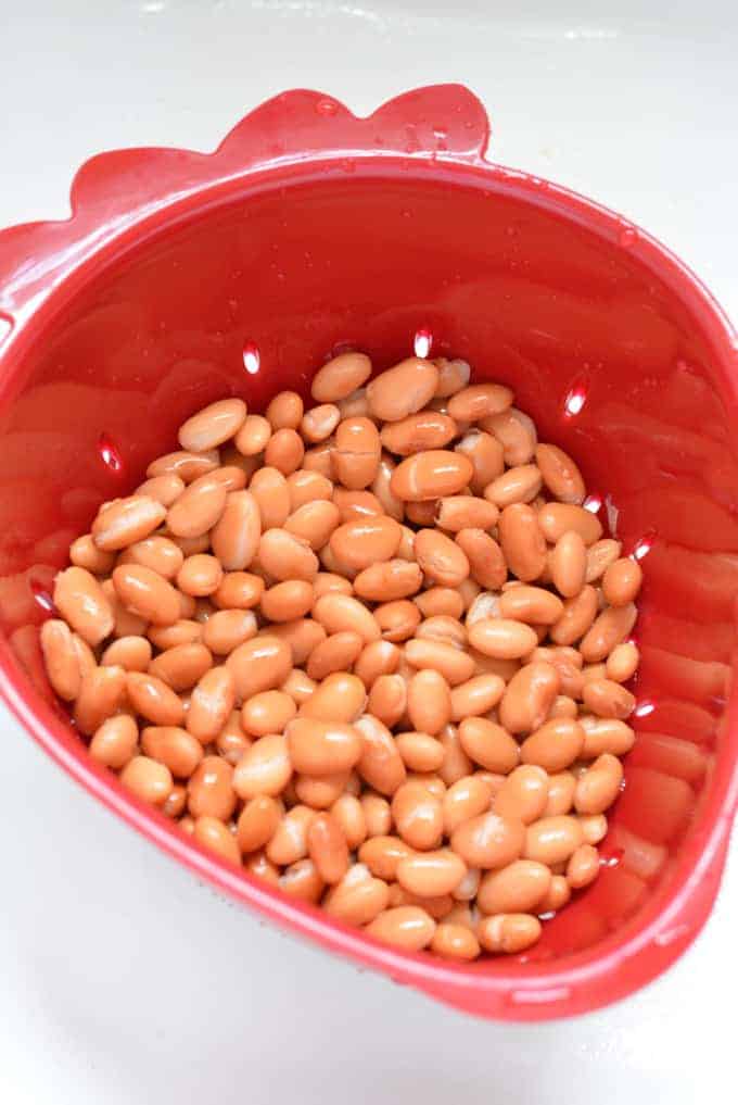 Pinto beans draining in a colander.